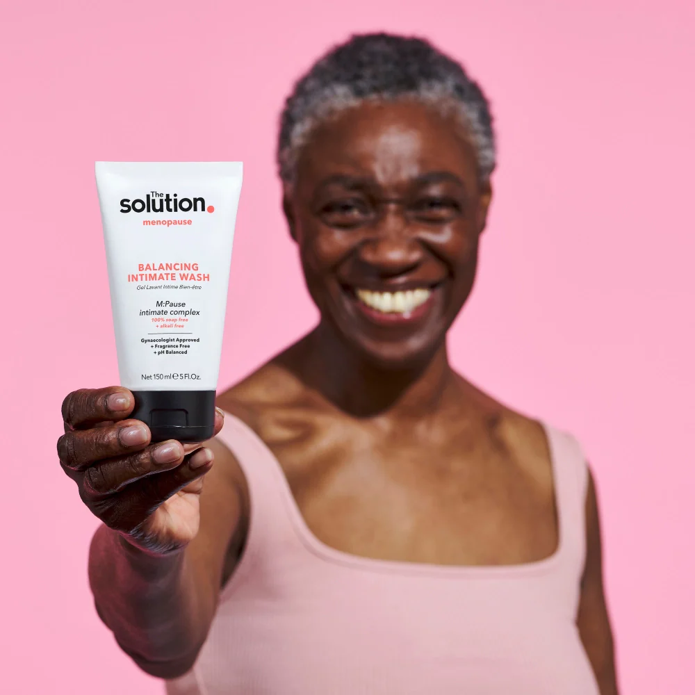 The_Solution_Menopause_Balancing_Intimate_Wash_150ml_Model_holding_product_2048x2048